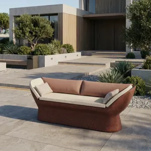 Ruby Red Luxury Concrete Sofa with Curved Arms and Terracotta Cushions - Luxury Hotel Furniture Lifestyle View by Luxury Group International