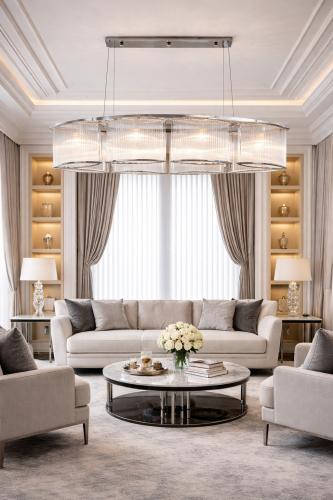 Luxury Modern Oval Art Deco Ribbed Glass Rod Chandelier with Gold/Chrome Finish by Luxury Group International