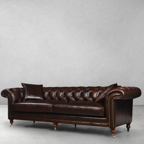 Brown Chesterfield Luxury Leather Sofa with Brass Castor Wheels - Living Room Furniture Front View by Luxury Group International