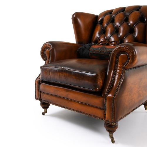 Chesterfield Wingback Luxury Button-Tufted Leather Sofa with Brass Castor Legs - Living Room Furniture Detail View by Luxury Group International
