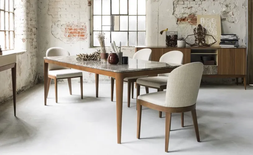 Cream Fabric Luxury Armless Upholstered Dining Chair with Dark Walnut Wooden Legs Lifestyle View by Luxury Group International