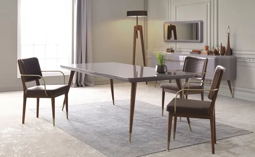 Dark Brown Walnut upholstered Wooden Luxury Dining Armchair with Patterned Fabric Back & Brass Accents Lifestyle View by Luxury Group International
