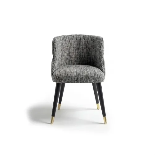Gray upholstered luxury dining chair with black leg & golden detailing by Luxury Group International