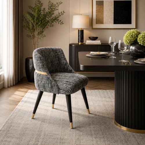 Gray upholstered luxury dining chair with black leg & golden detailing by Luxury Group International
