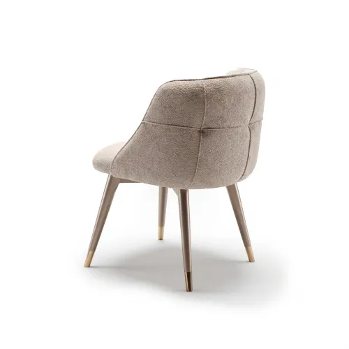 Light beige upholstered elegant modern luxury dining chair with paneled back by Luxury Group International
