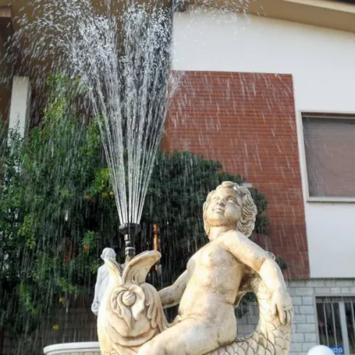 Luxury Baroque Cherub Sculpture Water Fountain with Multi-Curve Reservoir - Baroque Fountain Detail View by Luxury Group International