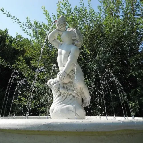Luxury Baroque Cherub Water Fountain with Circular Basin & Radiating Water Jets - Baroque Fountain Detail View by Luxury Group International