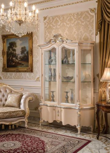 Luxury Cream Baroque Double Door Glass Display Cabinet with Sculpted Crown Pediment & Ornamental Storage Base Lifestyle View by Luxury Group International