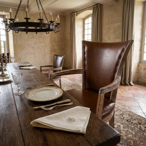 Luxury Distressed Wood Dining Armchair with Brown Leather Upholstery - Dining Room Furniture Lifestyle View by Luxury Group International
