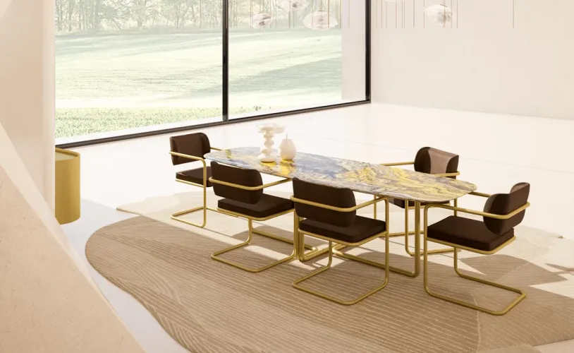 Luxury Dark Brown Upholstered Dining Chair with Armrest in Vintage Gold Finish Lifestyle View by Luxury Group International