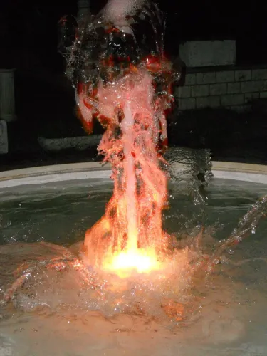 Luxury Illuminated Circular Baroque Water Fountain with Central Jet and Arc Spouts - Baroque Fountain Detail View by Luxury Group International
