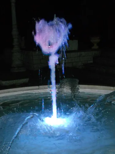 Luxury Illuminated Circular Baroque Water Fountain with Central Jet and Arc Spouts - Baroque Fountain Detail View by Luxury Group International