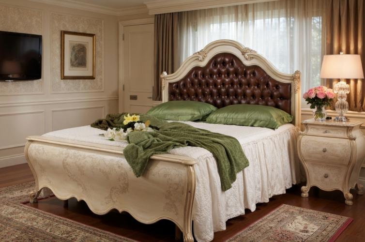 Luxury Ivory Baroque Double Bed with Brown Leather Button-Tufted Headboard & Gold Leaf Ornamental Curved Frame Lifestyle View by Luxury Group International