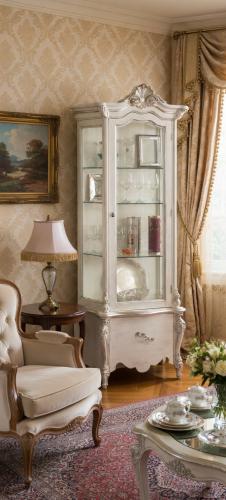 Luxury Ivory Baroque Single Door Glass Display Cabinet with Sculpted Crown Crest & Single Drawer Storage Unit Lifestyle View by Luxury Group International