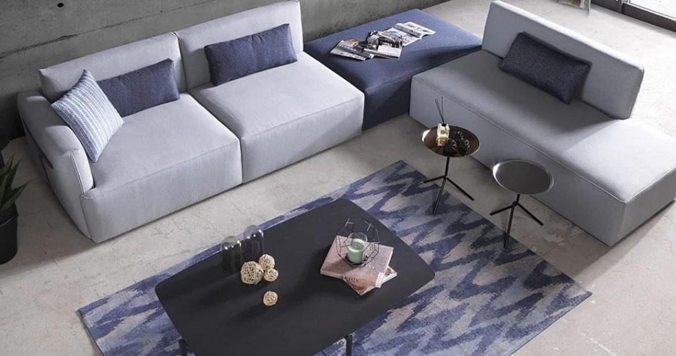 Luxury Light Grey Modular Corner Sofa with Navy Blue Ottoman – Modern Sectional Luxury Sofa Lifestyle View by Luxury Group International