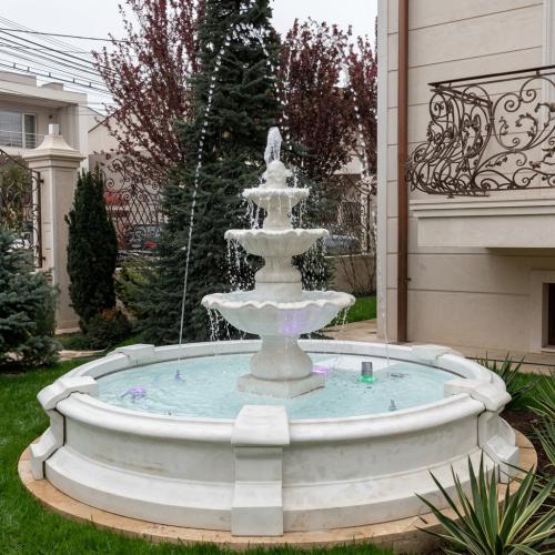 Luxury Ornamental Baroque Triple Tier water Fountain with Circular Reservoir - Baroque Fountain Lifestyle View by Luxury Group International