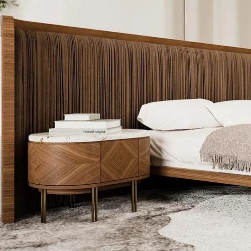 Luxury Oval Walnut Nightstand with Marble Top and Brass Legs for Modern Interiors Lifestyle View by Luxury Group International