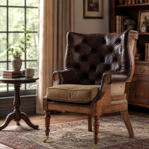 Sillón de cuero capitoné de lujo con estructura de madera de respaldo abierto y patas con ruedas de latón Vista lifestyle por Luxury Group International