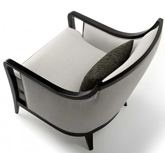 Luxury Upholstered Armchair in Soft Cream Fabric with Sculpted Matte Black Frame and Curved Open Arm Design by Luxury Group International