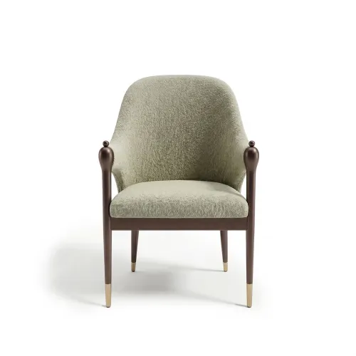 Pistachio green upholstered luxury dining chair with brown wooden legs by Luxury Group International