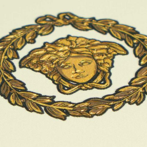 Versace Circular Medusa Ornaments Non Woven Wallpaper White Gold Black Detail View by Luxury Group International